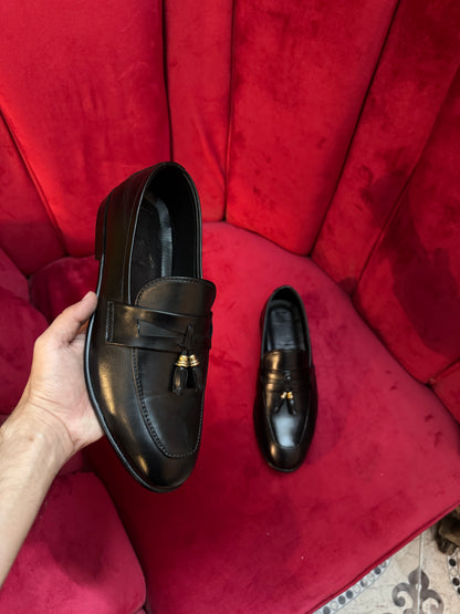 Black tassel shoes